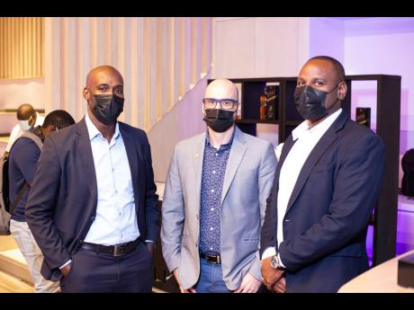 AC Hotel Kingston representatives (from left) Junior Blackhood, loss prevention manager; Koen Hietbrink, general manager; and Andre Harris, food and beverage manager, support the Johnnie Walker-sponsored event.