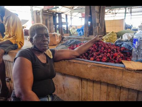 Minutes before noon yesterday, Coronation Market vendor Pauline Meredith was yet to sell a single pound of sorrel inside the downtown Kingston facility.