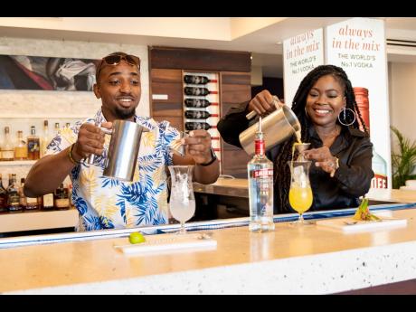 Courtney (left) and Dr Mickha Francis challenge each other in the Smirnoff Cocktail and Chill Mix Off. 