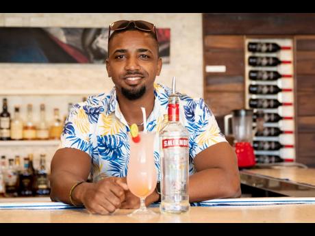 Courtney Francis poses with his winning Smirnoff Stinger signature cocktail.