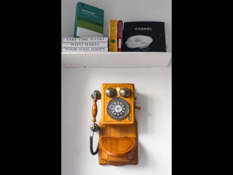 The retro antique wall corded phone adds to the decor of Green Gourmet’s quiet and homely space at 75 Hope Road. 
