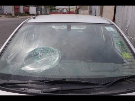 
The front windshield of the taxi driven by Osbourne Manning was allegedly damaged by a man of unsound mind.