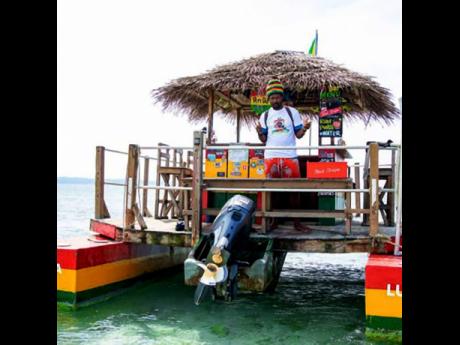 Scarlett’s motorised tiki bar goes from Negril to Booby Cay Island and back. 