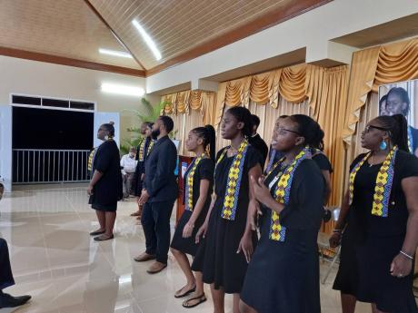 The Group Royal Priesthood ministering in song at the official opening of the new church hall at the Mandeville New Testament Church last Wednesday.
