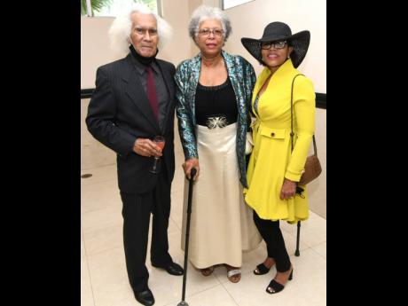 No doubt, Yvette Sterling (right) is tipping her hat to attorney-at-law Donna McIntosh Bryce-Gayle (centre), who was one of the practitioners celebrated for 50 years at the Bar. Standing with these ‘sterling’ women is Bryce-Gayle’s husband, Keith Gay