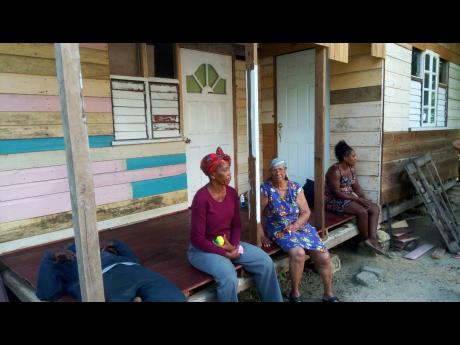Residents of Crowder, Westmoreland, mourn the gruesome killing of two goat owners. 