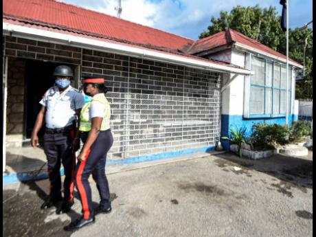 Police personnel stand in front of the Ferry Police Station on Tuesday. The facility is to undergo renovation.