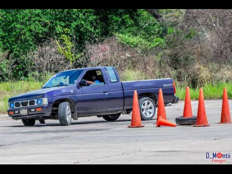 Sean McDonald, in his Nissan pickup, proving that anyone can have fun at a dexterity event.