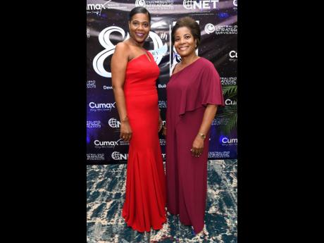 Marcia Osborne (left) and Angela Leigh were gorgeous in red and wine red at the Jamaica Co-operative Credit Union League ‘Celebration of the Stars’ long service awards ceremony. 
