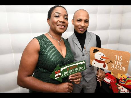 Melaine Campbell and Norval Roberts seem to be enjoying the season, but maybe one of them won’t getting any gifts from Santa this year. 