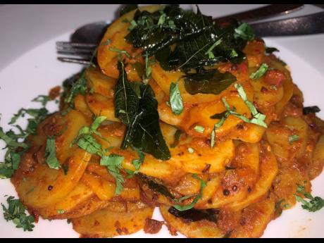 Aloo Katliyan Achari, sliced potatoes tossed with pickling spices and fresh coriander.