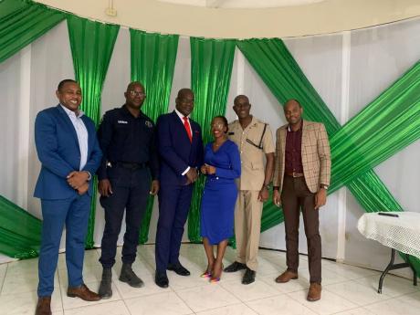 From left: Superintendent in charge of Crime for Area 3 Christopher Brown, Deputy Superintendent of Police in charge of Operations for Clarendon Anton Cardouza, Deputy Commissioner of Police Fitz Bailey in charge of the crime portfolio, Kemisha Anderson Th