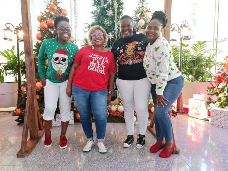 Leading ladies of marketing came out for Ugly Christmas Sweater Day at Digicel: (from left) Reshima Kelly-Williams, brand marketing manager; Nasha-Monique Douglas, chief marketing officer; Carla Hollingsworth, brand marketing manager; and, Georgine Smith, 