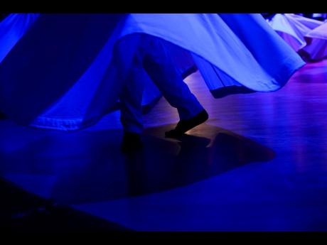 4. Whirling dervishes of the Mevlevi order perform during a Sheb-i Arus ceremony.