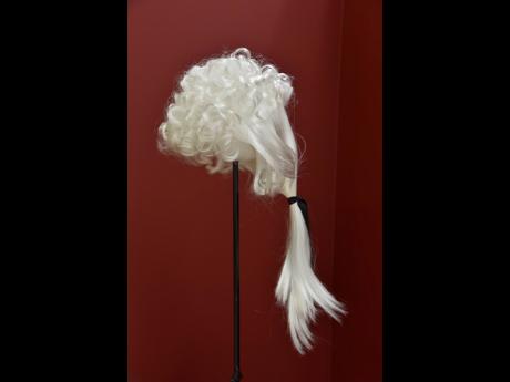 The Black Conundrum II wig on display is still being worn today in Jamaica, further perpetuating the cycle, says Bailey, of a lost identity.