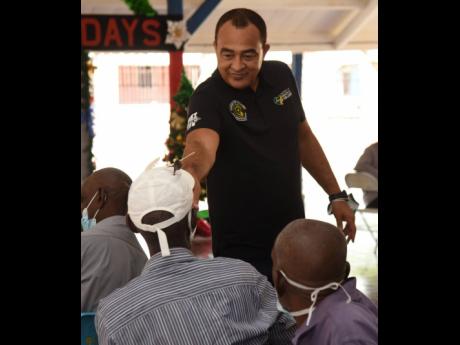 Dr Christopher Tufton, minister of health and wellness, interacts with patients of the Bellevue Hospital during the annual patients’ banquet held last Wednesday.