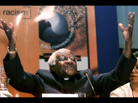 South African Anglican Archbishop Emeritus Desmond Tutu addresses a news conference at the World Conference Against Racism, in Durban, South Africa, Wednesday September  5, 2001. 