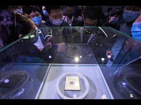 The ARM-structure server processor Yitian 710, developed by Alibaba’s in-house semiconductor unit T-Head, is seen on display on October 19.