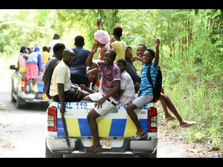 Hundreds of Jamaicans joined members of the security forces in combing the bushes in sections of St Thomas to rescue two young girls who were abducted from their homes in separate incidents within days.