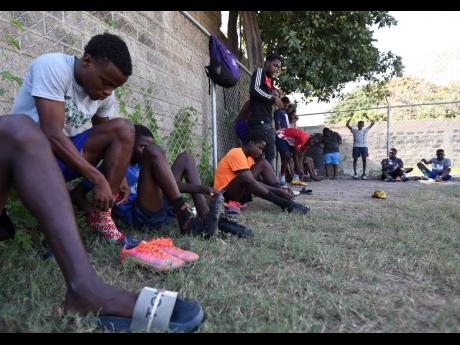Teenagers from Trench Town in St Andrew preparing to participate in a football competition organised by the Trench Town Impact Group last weekend.
