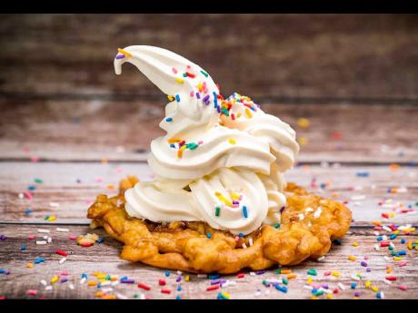 This funnel cake from Lea’s Sugar-Coated Treats is topped with vanilla ice cream.