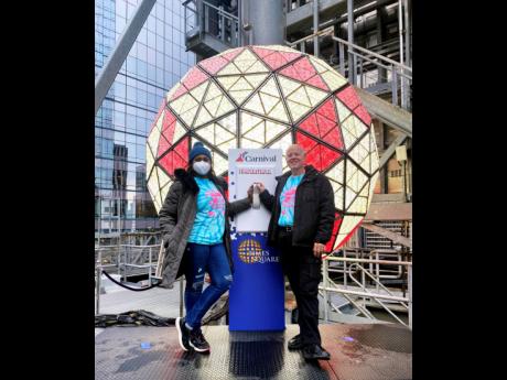 Jackson and Danny Magowan, the man behind the balloon segment of the official ball drop, stand infront of this year’s crystal ball, the Gift of Wisdom.
