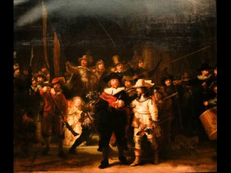 View of Rembrandt’s biggest painting the Night Watch showing the ripple in the painting in the top left corner, in Amsterdam, Netherlands, June 2021.