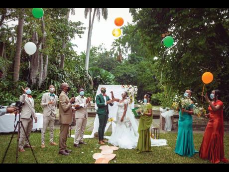  To mark the celebration of their union, the Robinsons and their bridal party released colourful balloons. 