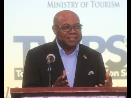 Edmund Bartlett, minister of tourism, addresses the launch of the Tourism Workers Pension Scheme at the Montego Bay Convention Centre on Wednesday.