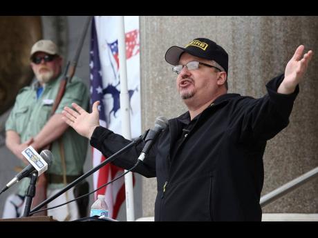 Stewart Rhodes, founder and president of Oath Keepers, speaks during a gun rights rally at the Connecticut State Capitol in Hartford, Connecticut, Saturday, April 20, 2013.   