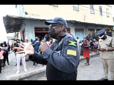 Senior Superintendent of Police Steve McGregor (left) and Superintendent Beresford Williams (right) in charge of Kingston Central Police Division meeting with the residents of Tel Aviv in Southside Central Kingston on the violence in the community on Frida