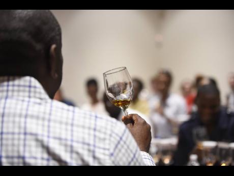 
An employee of Appleton Estates addresses a tour group at the complex in St Elizabeth in January 2018. Appleton Estates is operated by J. Wray & Nephew Limited. More than half of the company’s rum workers participated in the Campari Group employee share