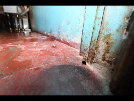 A spent casing is seen on a floor of the home of Quacie Harriott, who was fatally shot by the police in Tivoli Gardens, Kingston, on January 10.