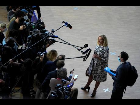 Dutch Finance Minister Sigrid Kaag, second right, speaks with the media as she arrives for a meeting of eurogroup finance ministers at the European Council building in Brussels on Monday, January 17, 2022.