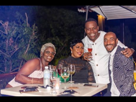 From left: June Hughes of June’s Orchid Atelier, ‘Budget Auntie’ Patricia Henry, birthday boy Brandon Ferguson, and Damion Reynolds, senior manager at Proven Investments were having a blast.