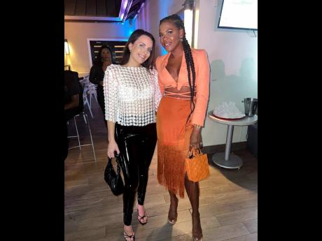 We spotted (from left) Leona Gaughan, senior manager, human resources business partner at Scotiabank, and wardrobe stylist and Flowerchild 1999 designer Kaysian Bourke.