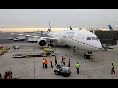 A Dreamliner 787-10 arriving from Los Angeles pulls up to a gate at Newark Liberty International Airport in Newark, New Jersey, on January 7, 2019.