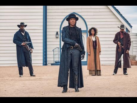 This image released by Netflix shows Regina King, centre, from the film ‘The Harder They Fall’.