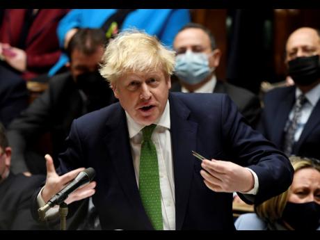 Britain’s Prime Minister Boris Johnson speaks during Prime Minister’s Questions in the House of Commons, in London yesterday. 