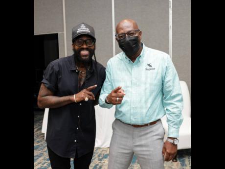 Reggae singer Tarrus Riley (left) with Karl Williams, Sagicor Group Jamaica senior vice-president, group human resources and corporate services. 