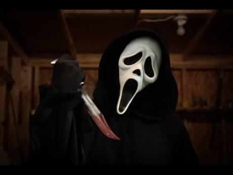 This image released by Paramount Pictures shows Ghostface in a scene from ‘Scream’.