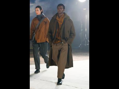 Right: Tasteful and deceptively simple designs graced the Lemaire runway. Winston Lawrence, known simply as Lawrence, walked the runway for the fashion house’s fall/winter 2022/2023 menswear collection in Paris.