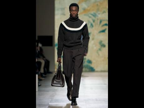 Hermes’ Left Bank show infused the design houses typically high fashion looks with a subtle yet distinct 1980s kick. We spotted Nigerian SAINT star David Adebola walking the runway for the classy and masculine fall/winter 2022/2023 showing. 