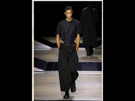 Louis Gabriel Nouchi’s LGN collection featured lots of exposed skin, shades, leotards and loose shirts and tops that seemed to drip down the models like sweat. Romaine Dixon walked the runway in a monochrome look. 