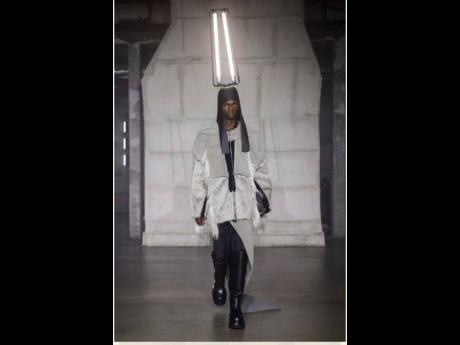 Rick Owens mounted an eccentric and highly creative show that saw models with strobe lights on their heads. Lawrence did the balancing act for fall/winter 2022/2023 menswear collection in Paris that featured woolen ‘drella’ coats, tied around models li
