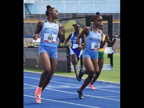 Edwin Allen High School sprinter Tina Clayton (left) and her twin sister, Tia.