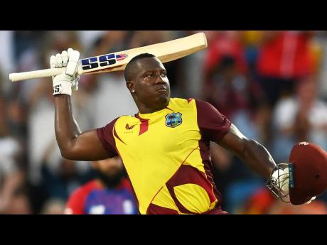 West Indies all-rounder Rovman Powell celebrates getting to a century during the third T20 against England in Bridgetown, Barbados yesterday. 