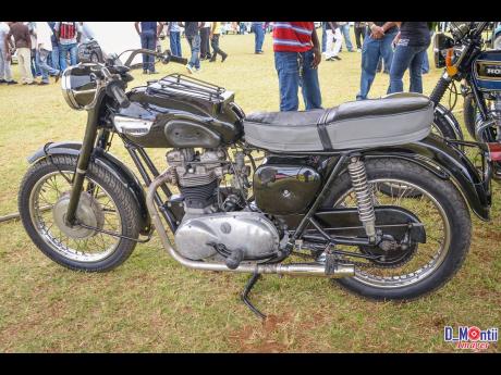 A classic Triumph motorcycle on display at an event in Mandeville.