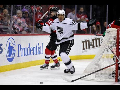 AP
Los Angeles Kings (centre) Quinton Byfield (55) reacts after losing his stick while battling for the puck with New Jersey Devils defenceman Damon Severson (28) during the first period of an NHL hockey game on Sunday, January 23, 2022, in Newark, NJ. 