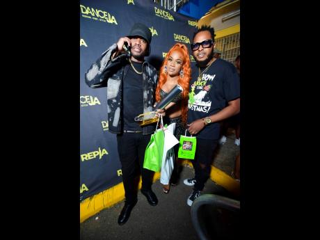 From left: Recording artiste and Ravers principal Ding Dong, Kadia ‘Kadii FirstClass’, who was the presenter for the Dance JA Awards and Bravo Ravers step into the spotlight for a photo op. Ding Dong received the International Dancehall King award. 
